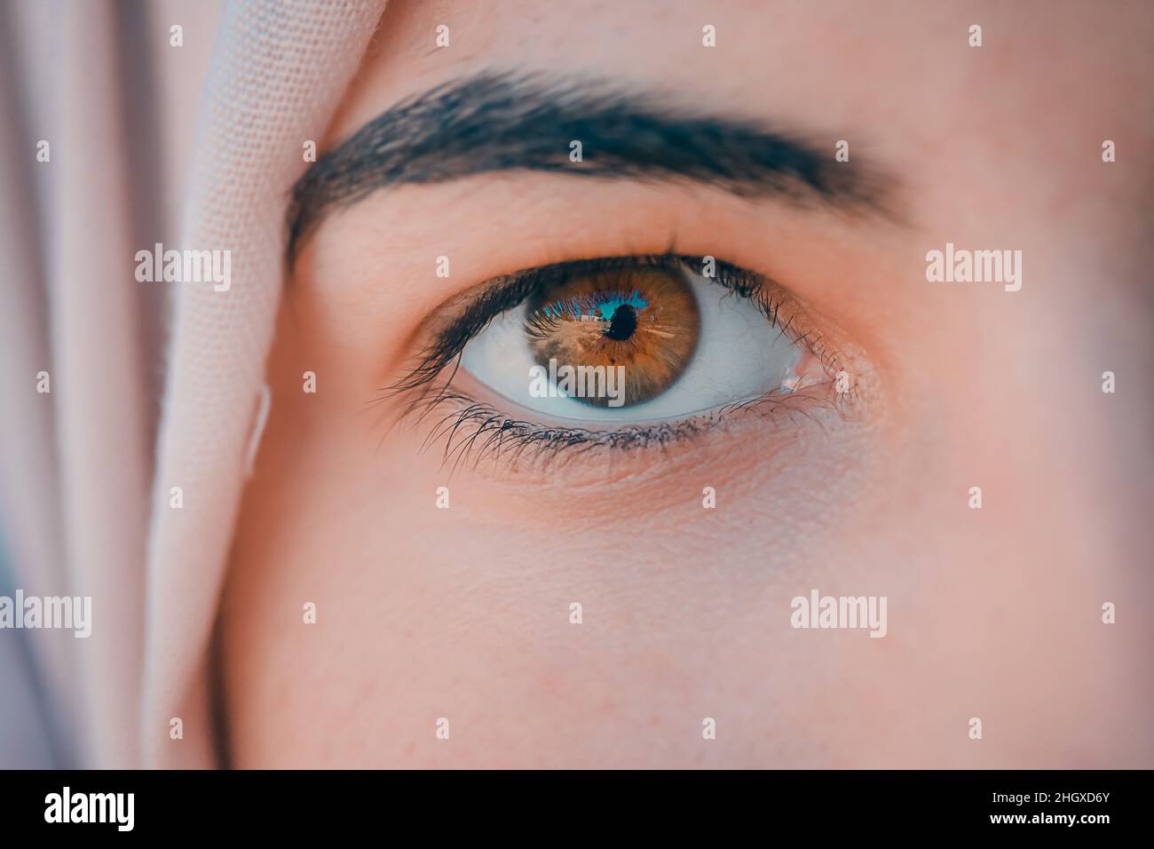 close up of an Arabian hijabi muslim girl honey or Hazel eye color Stock Photo