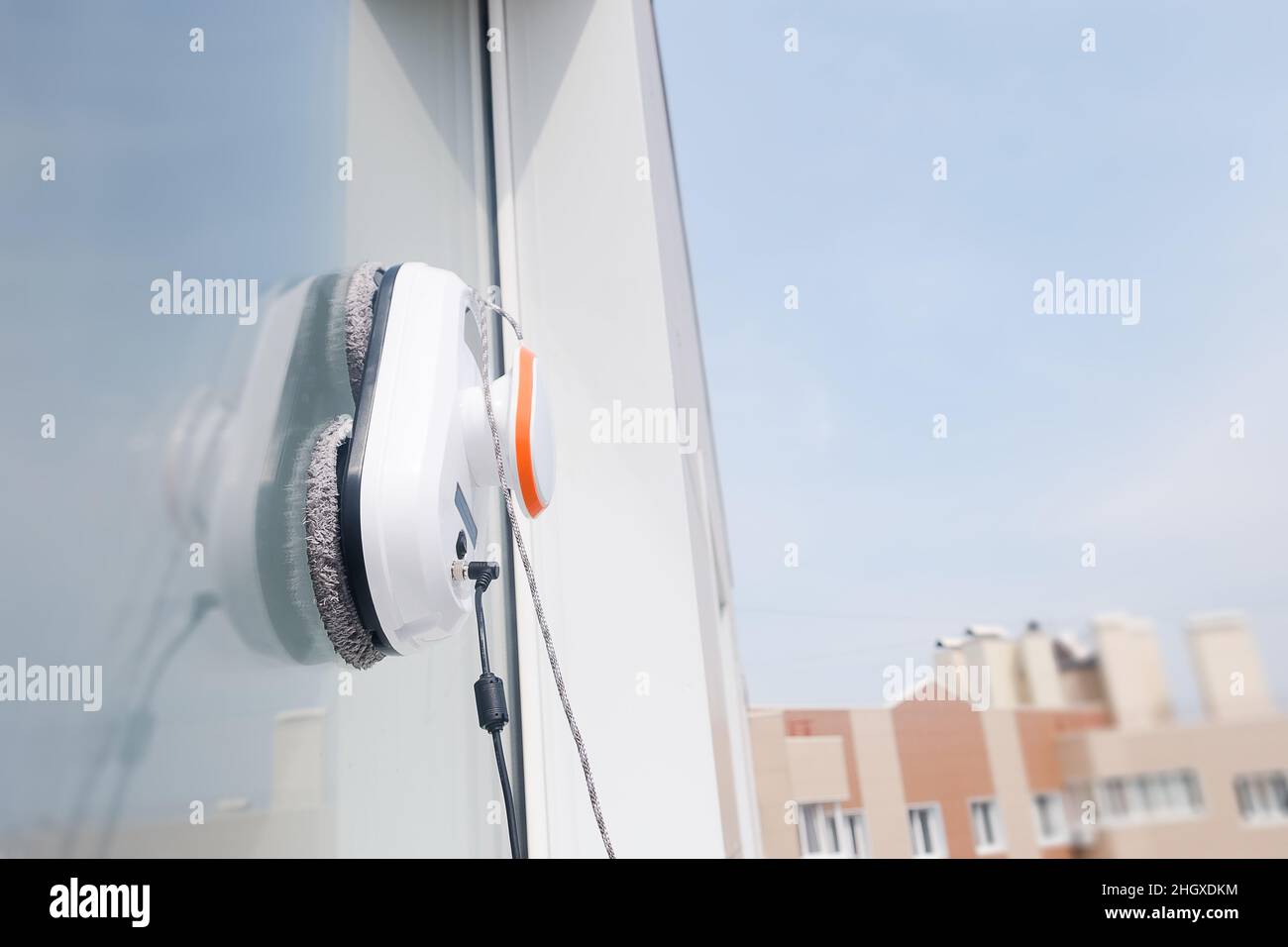 Robot cleaner work outside the dirty window. Cleaning the house with