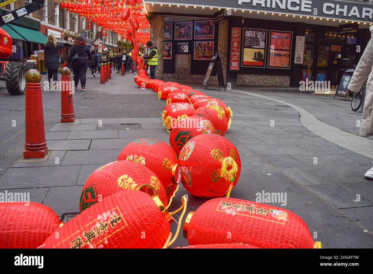 London, UK. 22nd Jan, 2022. A worker installs new red lanterns in London's Chinatown ahead of Chinese New Year. Credit: SOPA Images Limited/Alamy Live News Stock Photo