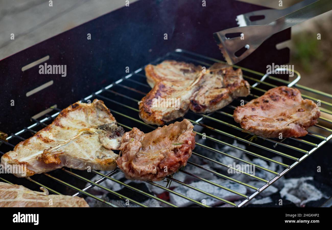 pieces of meat on the grill of a barbecue Stock Photo Alamy