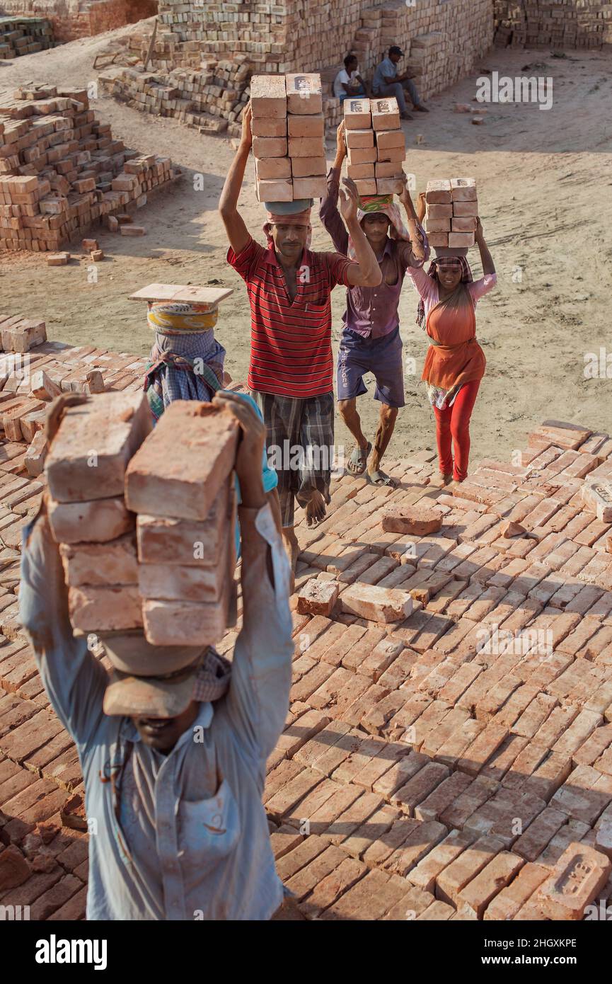 Dalit (untouchable) workers in a brick factory on the outskirts of Kolkata (Calcutta) in India. The working conditions are very harsh. Stock Photo