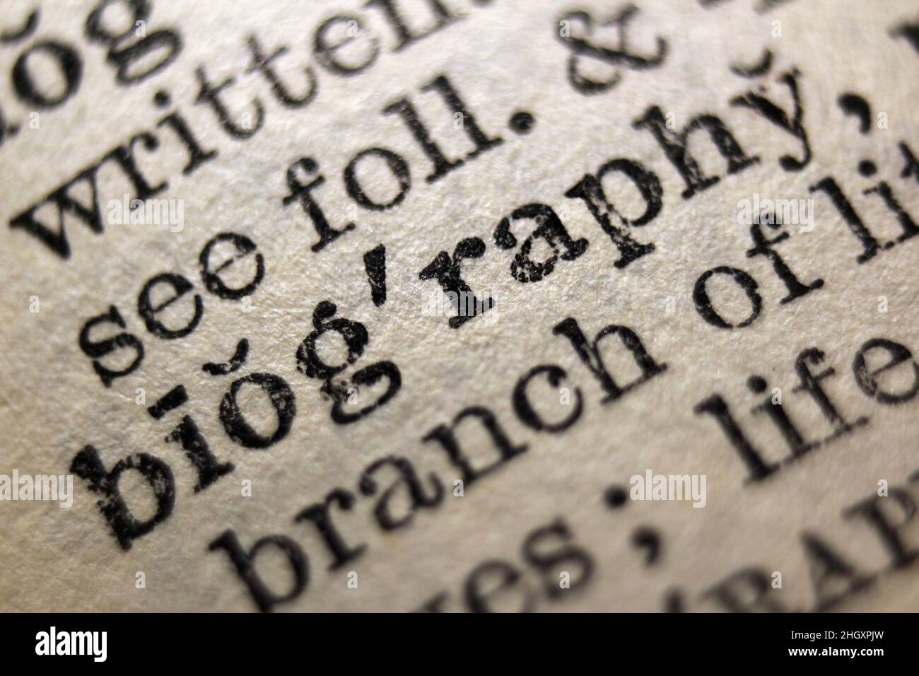 Word 'biography' printed on dictionary page, macro close-up Stock Photo