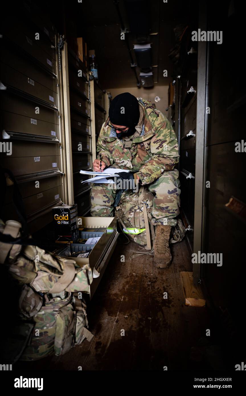 Spc. Rad Flores, Echo Company, 2nd Battalion 227th Aviation Regiment, 1st Air Cavalry Brigade, inventories vehicle mechanical parts inside a maintenance parts trailer for training exercise Allied Spirit 22, Joint Multinational Readiness Center, Hohenfels, Germany.   (U.S. Army photo by Sgt. Cesar Rivas, 164th Air Defense Artillery Brigade) Stock Photo