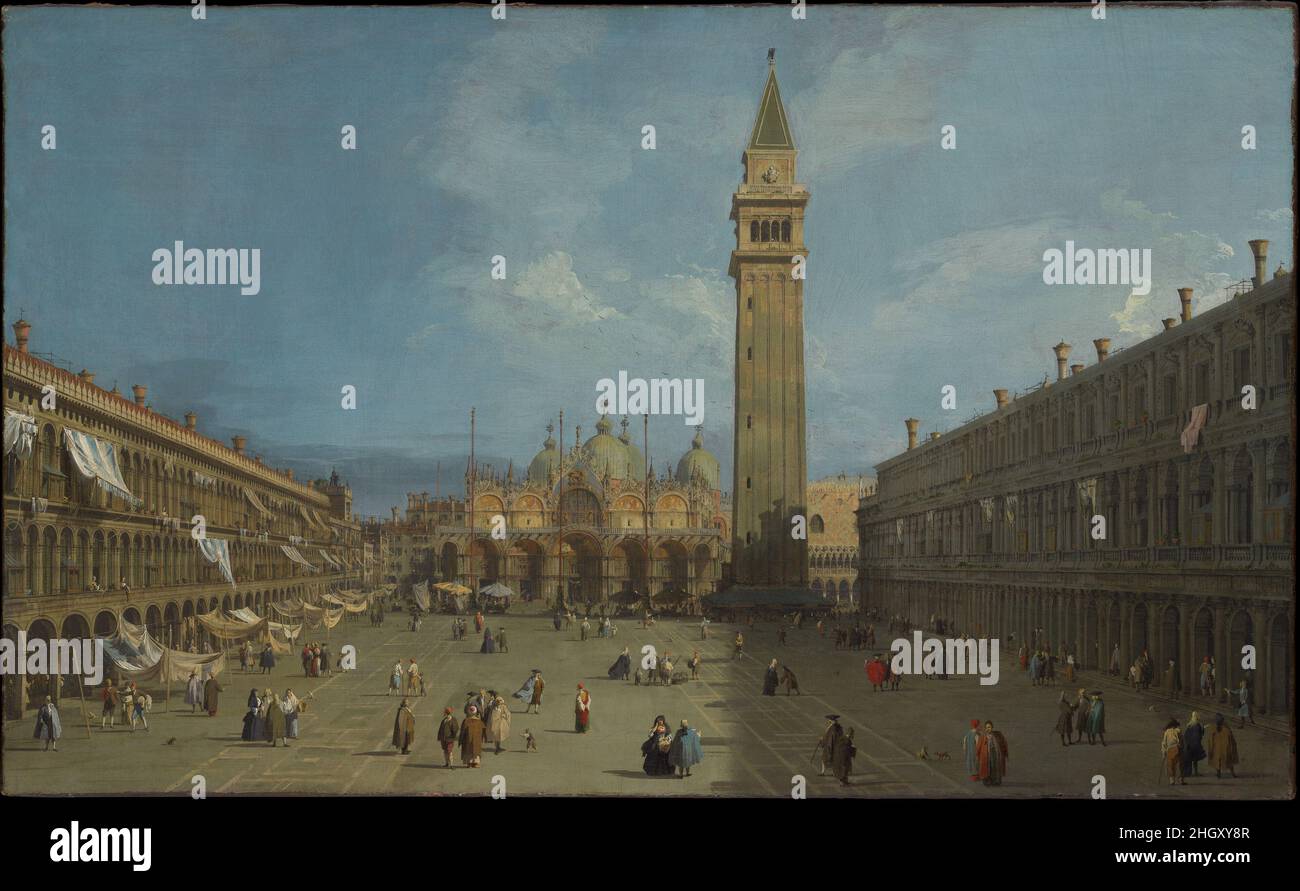 Piazza San Marco late 1720s Canaletto (Giovanni Antonio Canal) Italian The most celebrated view painter of eighteenth-century Venice, Canaletto was particularly popular with British visitors to the city. This wonderfully fresh and well-preserved canvas shows Piazza San Marco. Canaletto reduced the number of windows in the bell tower and extended the height of the flagstaffs, but otherwise he took few liberties with the cityscape. In fact, this painting can be situated among the artist’s other views of the square because of his meticulous documentation of various stages in the laying of its pav Stock Photo