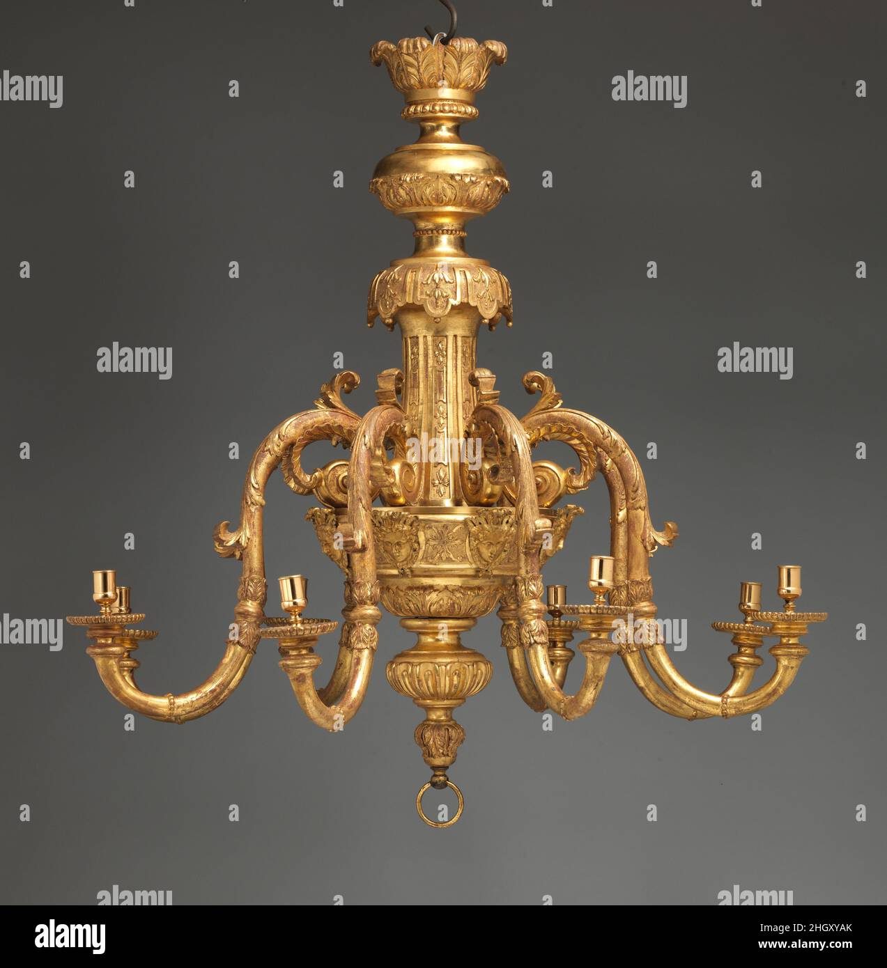Chandelier ca. 1710–15 Attributed to John Gumley This is one of a pair of chandeliers commissioned about 1710 by James, third Viscount Scudamore (1684–1716), for the state apartments at Holme Lacy, Herefordshire.[1] They may have been ordered to celebrate his marriage in 1710. In the richly decorated Baroque plasterwork of the saloon and dining room where they were hung, the chandeliers were a particularly harmonious addition. Holme Lacy later descended to the earls of Chesterfield; it was sold in 1910 by the tenth earl, who in 1917 moved many of the contents to Beningbrough Hall, North Yorksh Stock Photo
