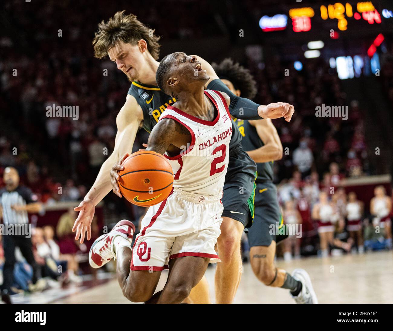 Norman, Oklahoma, USA. 22nd Jan, 2022. Oklahoma Sooners guard Umoja Gibson (2) is fouled by Baylor Bears guard Matthew Mayer (24) while driving the ball to the basket on Saturday, January 22, 2022 at the Lloyd Noble Center in Norman, Oklahoma. (Credit Image: © Nicholas Rutledge/ZUMA Press Wire) Stock Photo