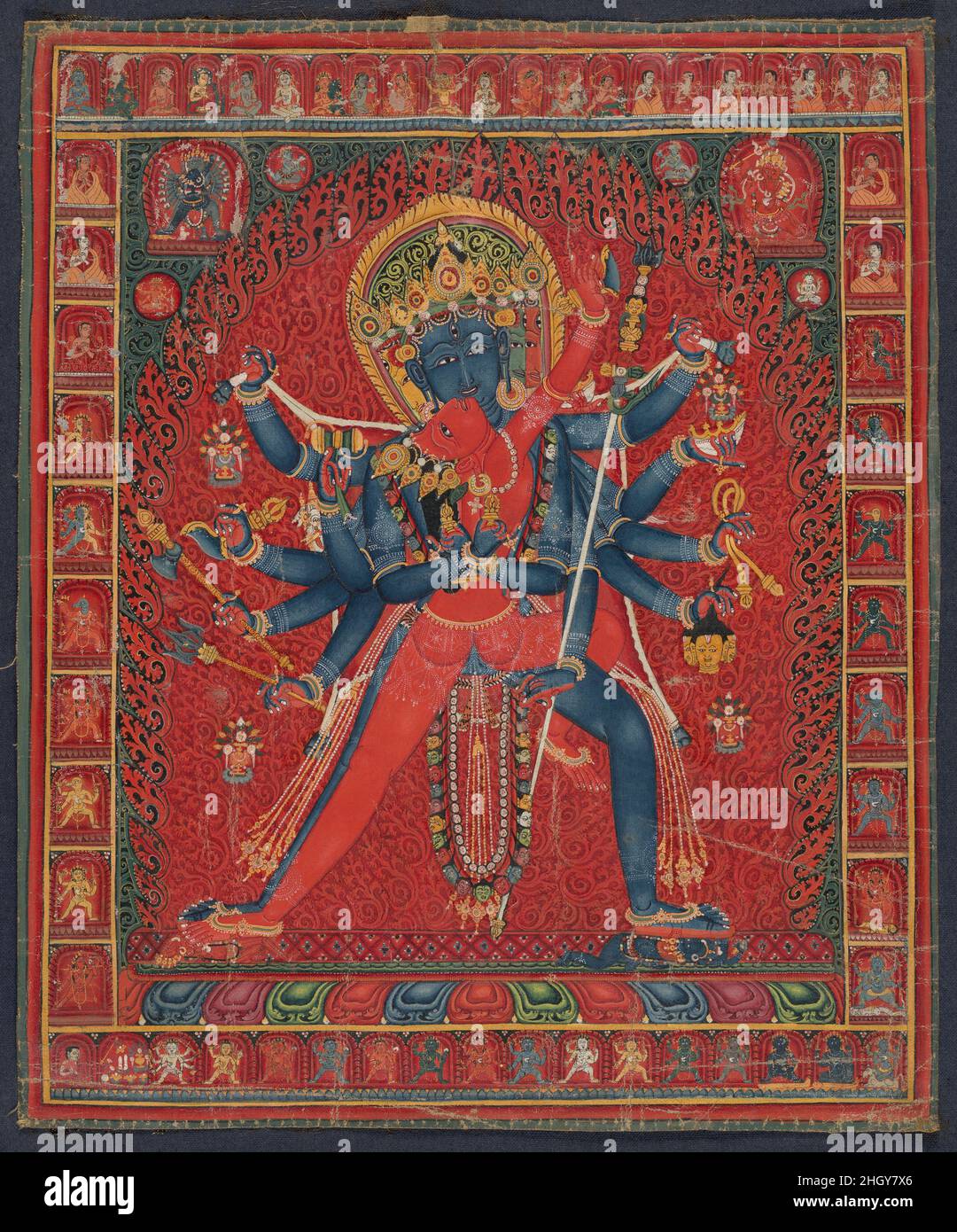 Chakrasamvara and consort Vajravarahi 1450–1500 Central Tibet This powerful depiction of Chakrasamvara embracing his yogini consort Vajravarahi is a highly energized visualization, such as would have been experienced by an advanced tantric master. These are key deities in the Vajrayana system, uniting two of the most powerful ideas in esoteric Buddhism, wisdom, embodied in Vajravarahi, and compassion, the essence of Chakrasamvara. His name, which translates as Circle of Bliss, embodies the powerful union of these two fundamentals tenets of Buddhism. This is arguably one of the finest represent Stock Photo