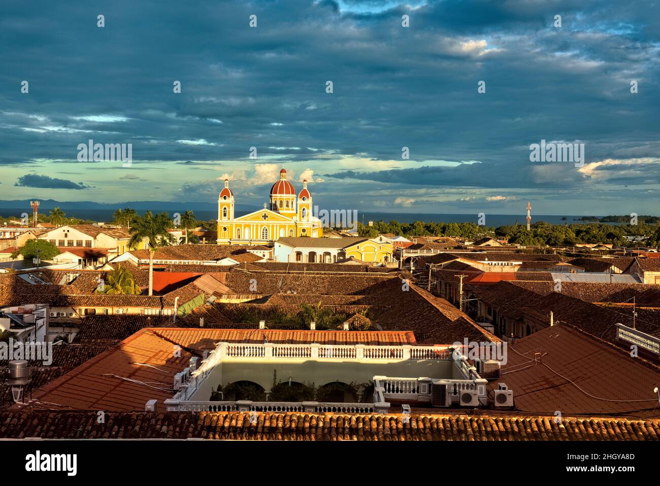 The beautiful neoclassical Granada Cathedral  and the roofs of colonial Granada, Nicaragua Stock Photo