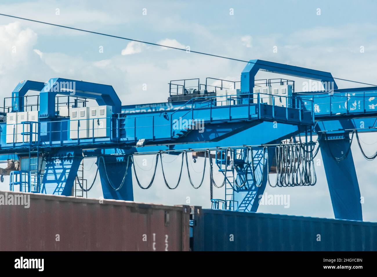 Heavy Lifting Industrial Crane for Cargo Container Import and Export Freight Transportation. Stock Photo