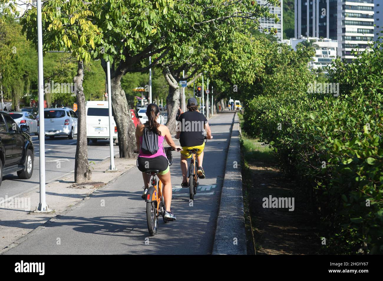 Rio de Janeiro, Brazil,May 11, 2021.People riding rented bicycles on the rodrigo de freitas lagoon bike path, in the southern part of the city of Rio Stock Photo