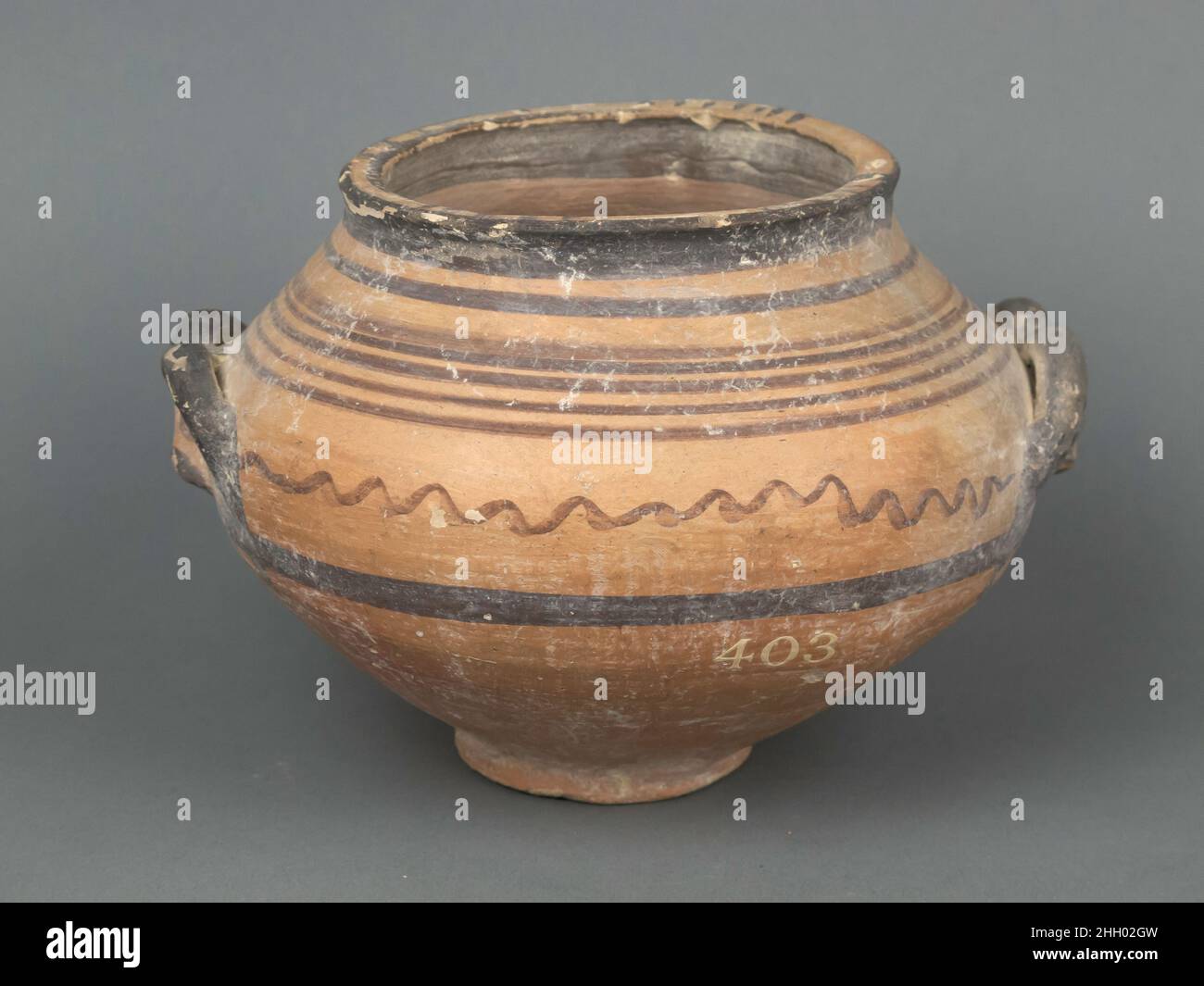 Bowl 850–750 B.C. Cypriot Bowl with ibex heads for handles, and straight and wavy bands.. Bowl. Cypriot. 850–750 B.C.. Terracotta. Cypro-Geometric III. Vases Stock Photo