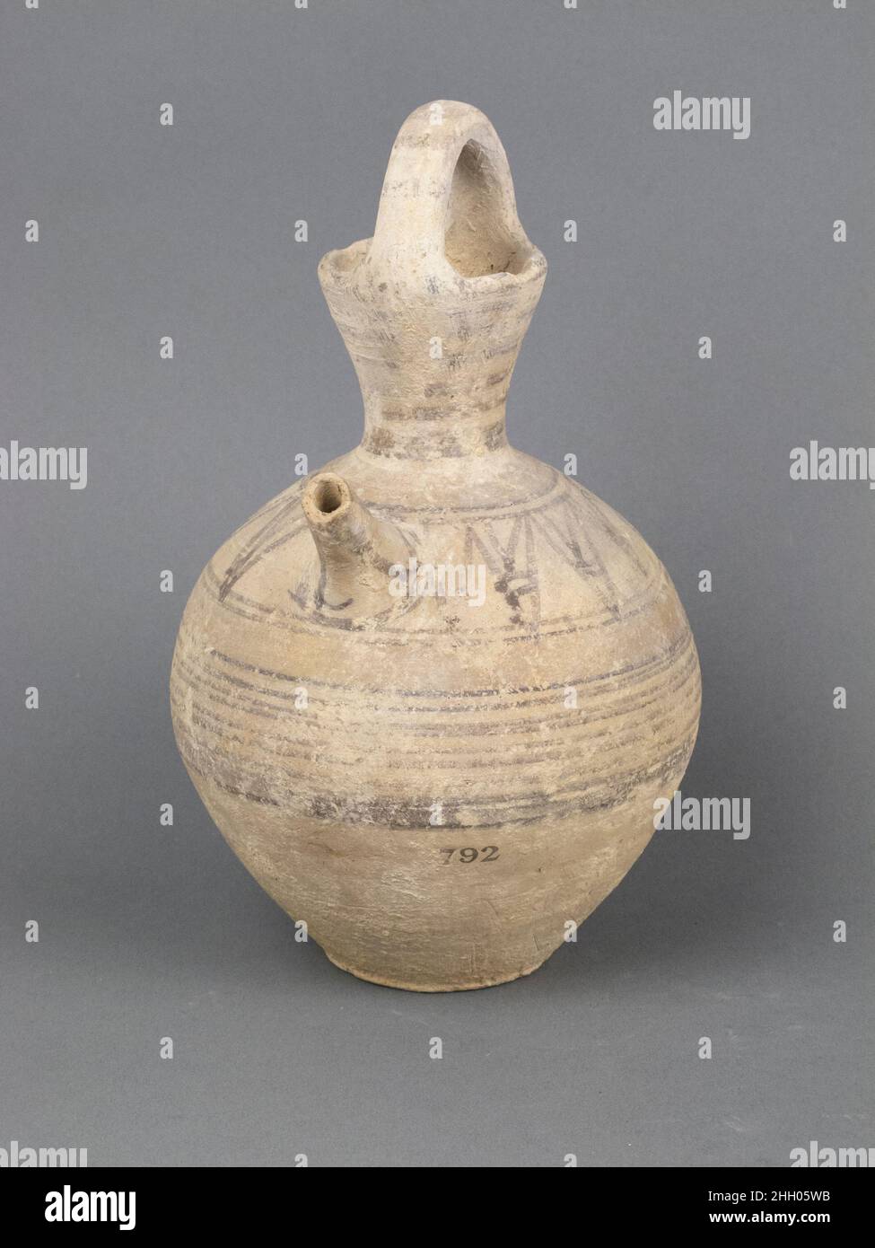 Juglet 750–600 B.C. Cypriot Tubular spout and rudely drawn lotus flowers on shoulder.. Juglet. Cypriot. 750–600 B.C.. Terracotta. Cypro-Archaic I. Vases Stock Photo