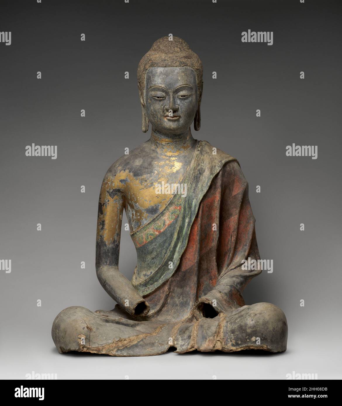 Buddha, Probably Amitabha early 7th century China The position of the Buddha’s arms indicates that the hands were once held in a gesture of meditation and suggests that this sculpture represents Amitabha, a celestial Buddha who presides over his Western Paradise. Devotion to Amitabha, a major component of Chinese Buddhist practice since the sixth century, promotes the goal of rebirth in Amitabha’s Pure Land, where conditions are conducive to achieving spiritual understanding. The sculpture was made using the dry-lacquer technique, in which a core (often made of wood) is covered with clay and t Stock Photo