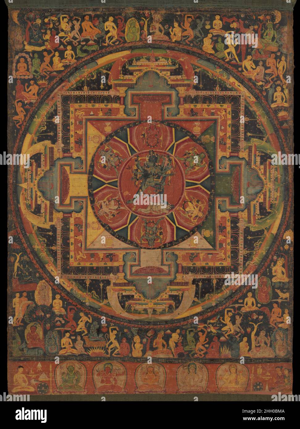 Chakrasamvara Mandala ca. 1100 Nepal This ritual diagram (mandala) is conceived as the cosmic palace of the wrathful Chakrasamvara and his consort, Vajravarahi, seen at center. These deities embody the esoteric knowledge of the Yoga Tantras. Six goddesses on stylized lotus petals surround the divine couple. Framing the mandala are the eight great burial grounds of India, each presided over by a deity beneath a tree. The cemeteries are appropriate places for meditation on Chakrasamvara and are emblematic of the various realms of existence. The lower register contains five forms of the goddess T Stock Photo