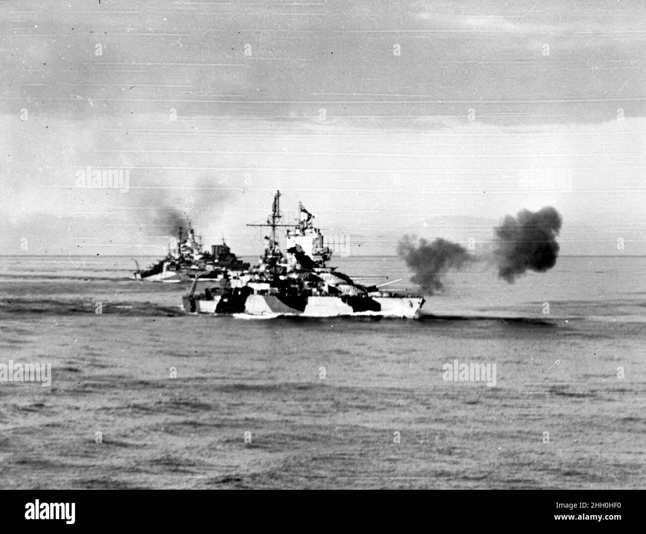 The USS Mississippi firing on the Lingayen Gulf attack and invasion force during the Pacific War in WW2 Stock Photo