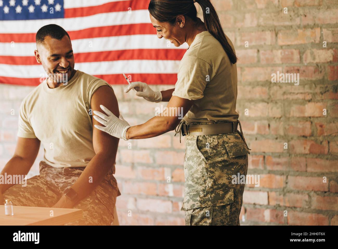 American military doctor administering a dose of the covid19 vaccine