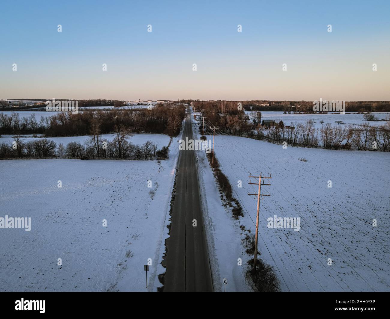 Vanishing point road with winter landscape in rural area. Stock Photo