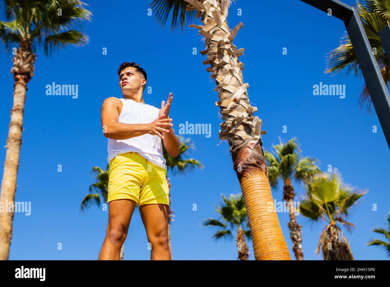 young modern ballet dancer looking away with tired look in summer beach sunny Stock Photo