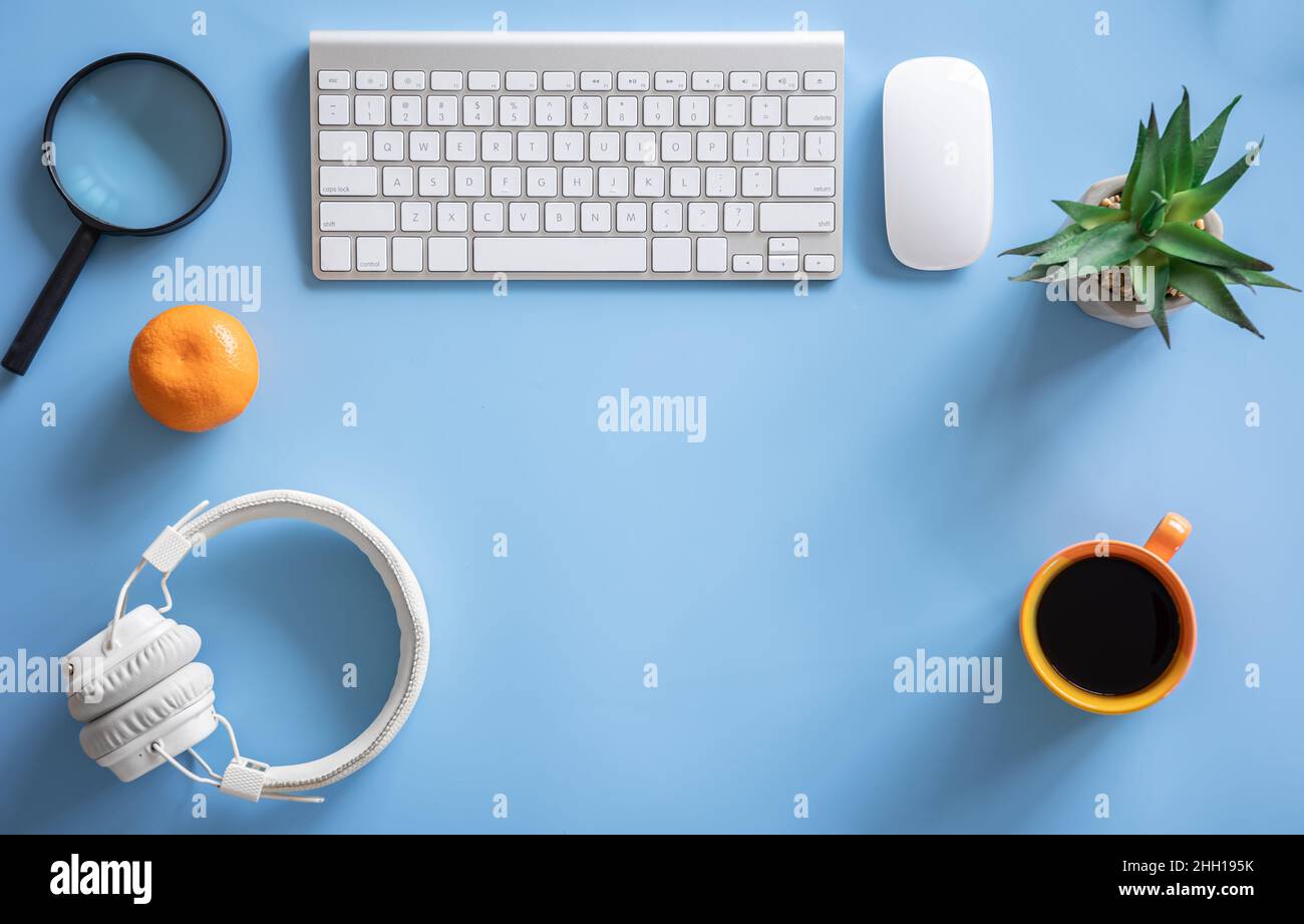 Flat lay, hobby, study and work concept on blue background. Stock Photo