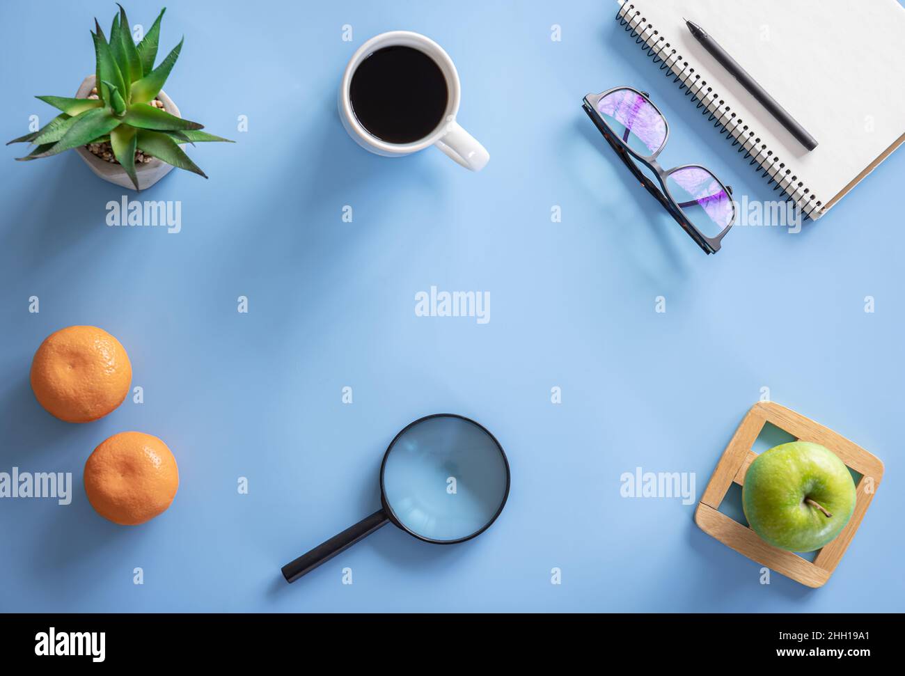 Flat lay, hobby, study and work concept on blue background. Stock Photo