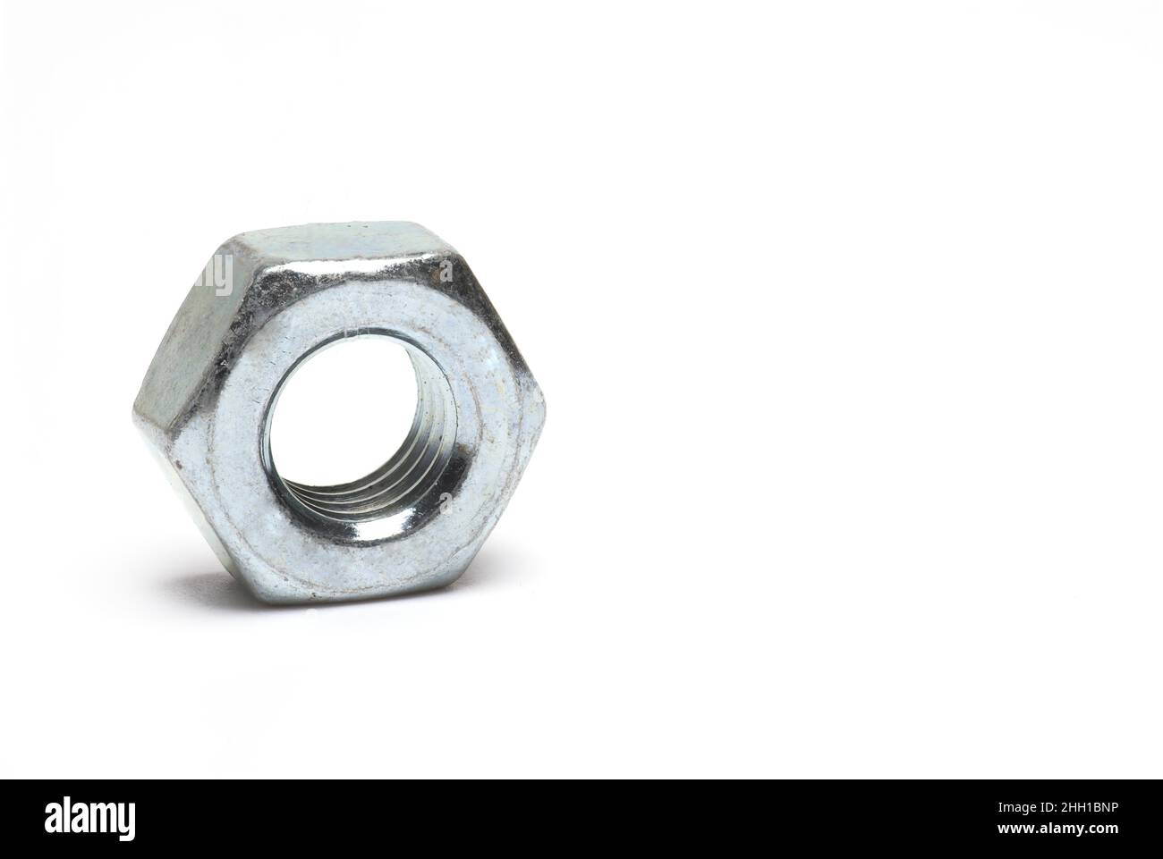 Close up of steel hex nut with metric thread on white background Stock ...
