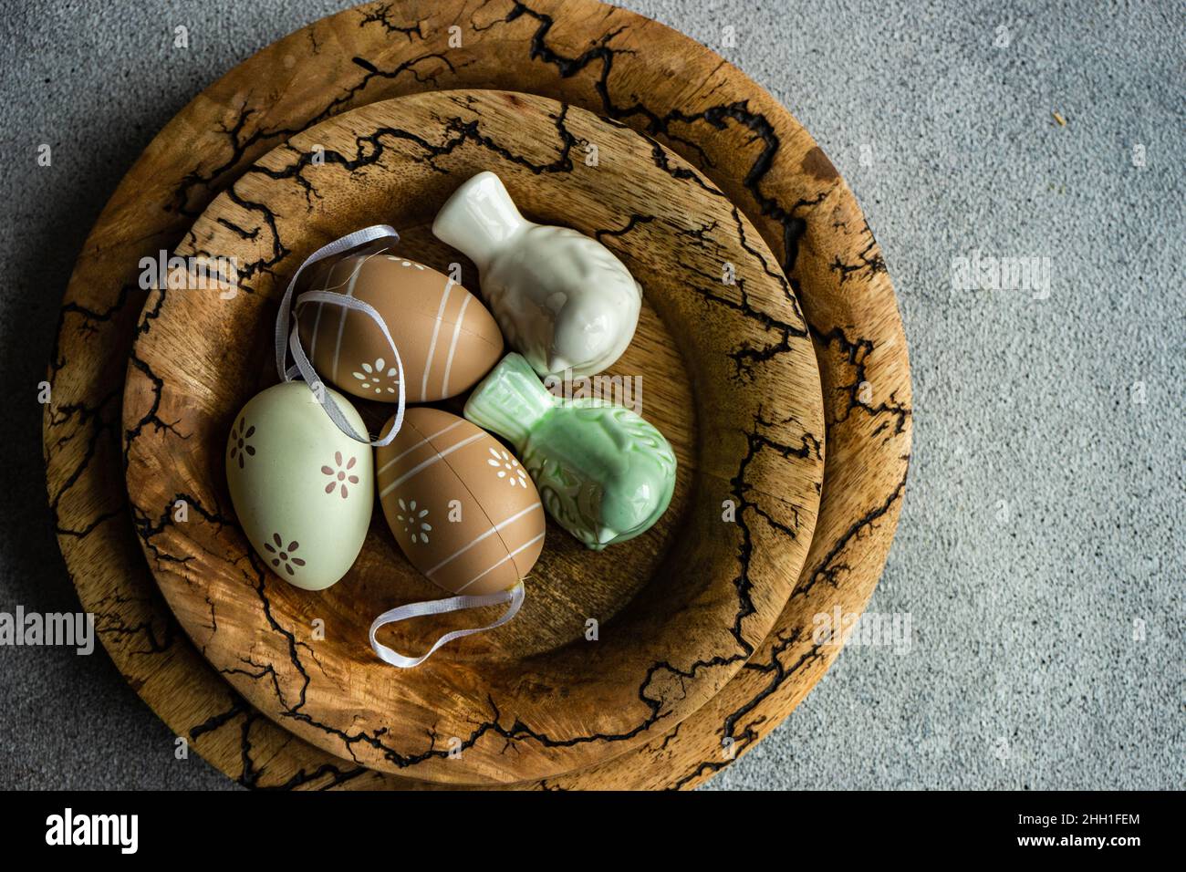 Easter dinner table settinf with colored eggs served on the table Stock Photo