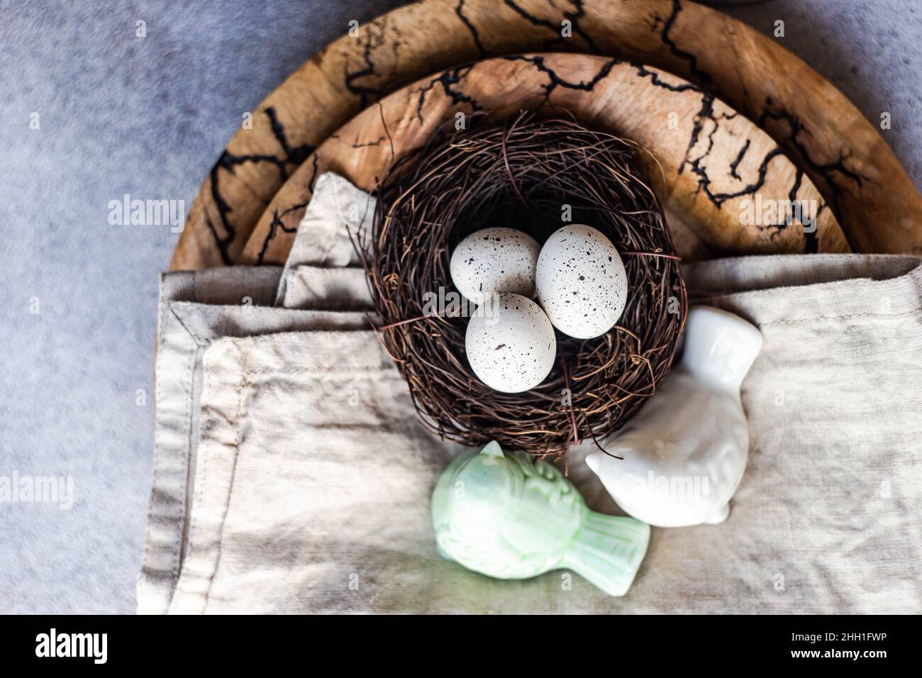 Easter dinner table settinf with colored eggs served on the table Stock Photo