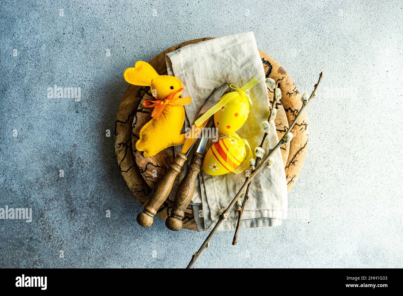 Easter dinner table settinf with colored eggs served on the table Stock Photo