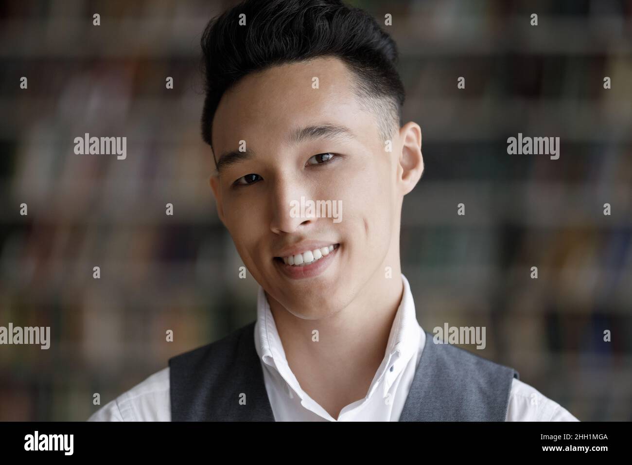 Happy young Asian student guy head shot portrait Stock Photo