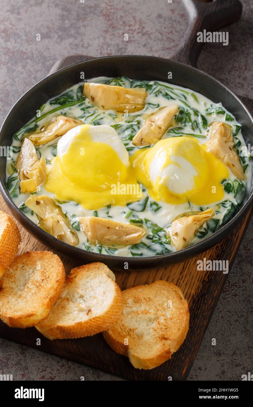 New Orleans traditional eggs sardou with spinach cream, artichokes