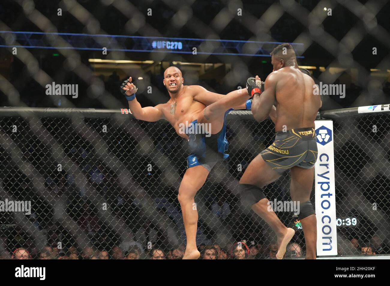 ANAHEIM, CA - JANUARY 22: (L-R) Ciryl Gane kicks Francis Ngannou in their  Heavyweight championship fight during the UFC 270 event at Honda Center on  January 22, 2022 in Anaheim, California, United