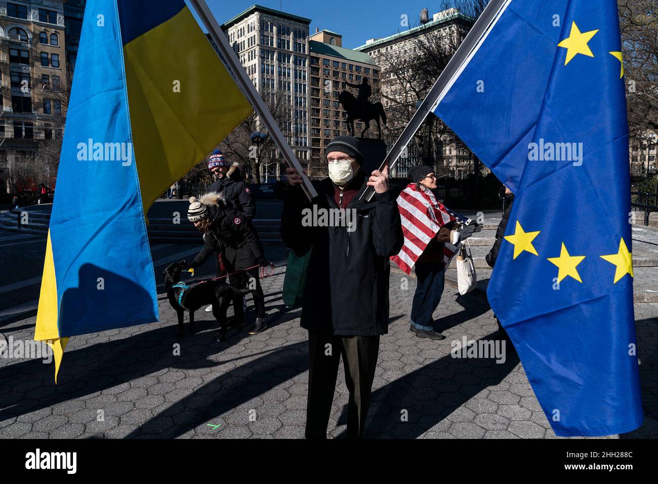 New York, United States. 22nd Jan, 2022. Protester holds Ukrainian and European Union flags during Stand with Ukraine rally against Russian aggression on Union Square. Protesters held posters accusing Russia of crimes against Ukraine. They were also holding flags by Belarus and Georgia, symbolizing Russian interference with those countries. (Photo by Lev Radin/Pacific Press) Credit: Pacific Press Media Production Corp./Alamy Live News Stock Photo