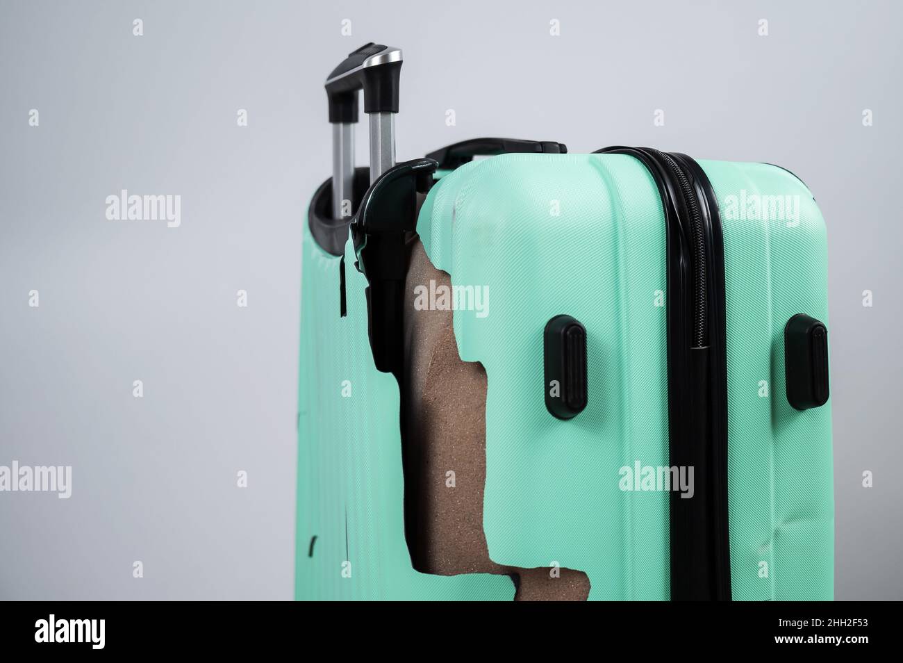 Close-up of a broken plastic suitcase on a white background Stock Photo ...