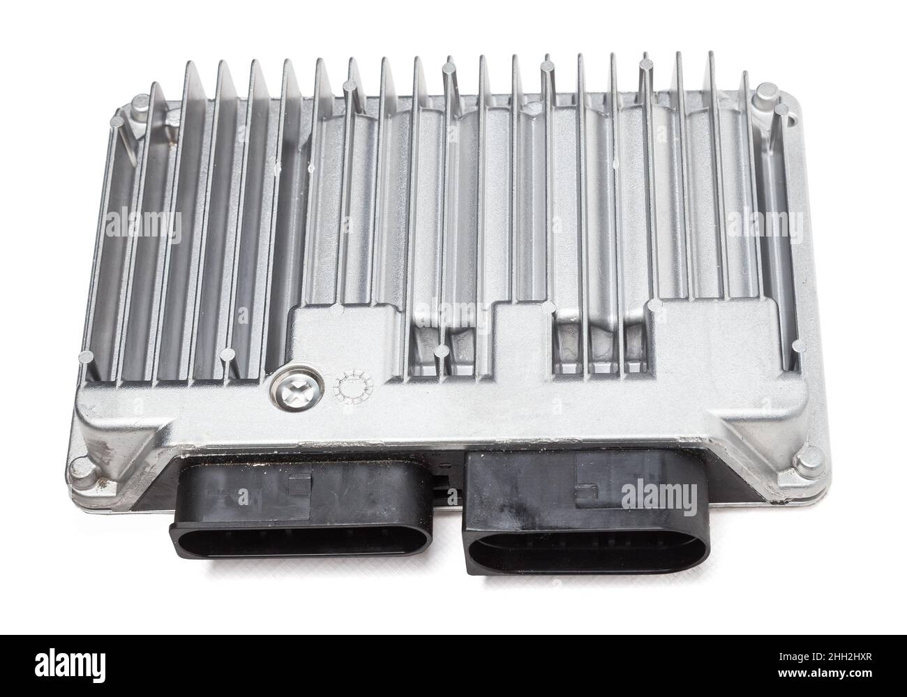Metallic car engine control unit with plastic elements on a white ...
