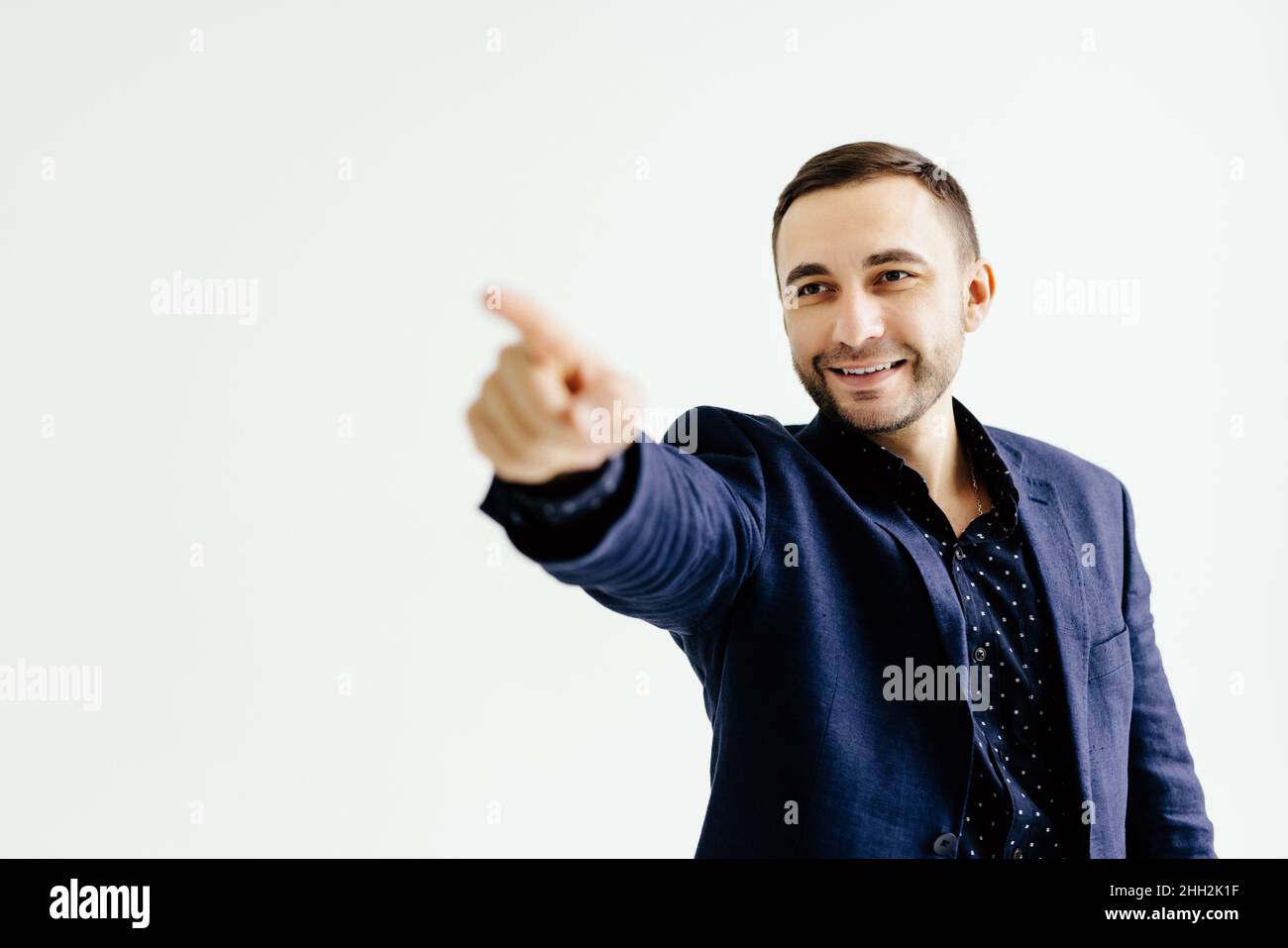 Businessman pressing an imaginary button on white Stock Photo