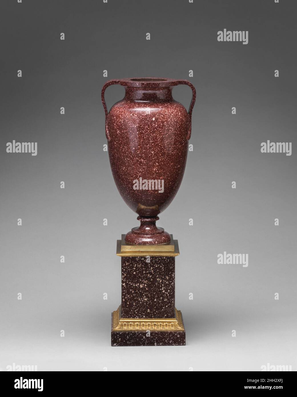 A Porphyry Urn Form Raised on Square Base A Porphyry Urn Form Raised on Square Base