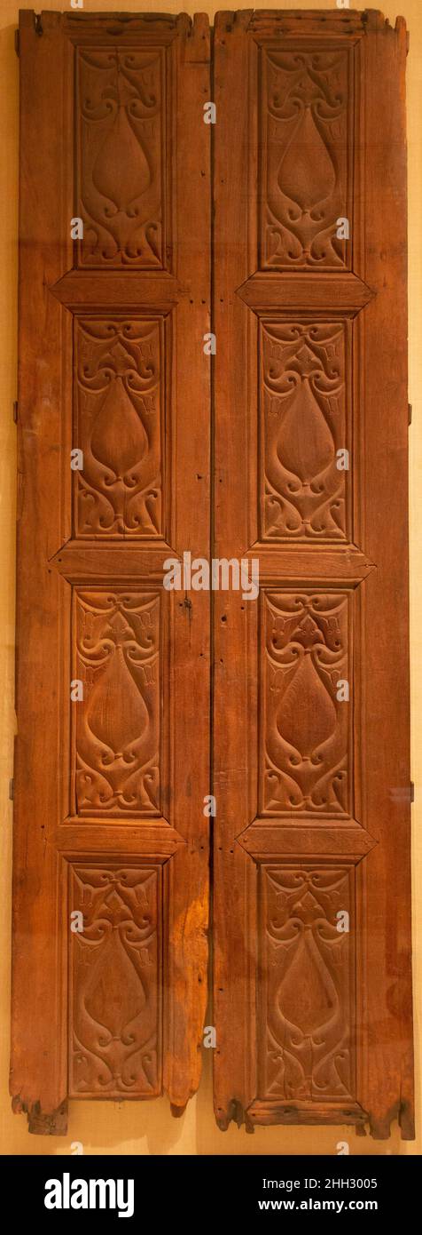 Pair of Doors 9th century The Beveled style, which is seen in many different media in Islamic art, is identified most closely with Samarra, the ninth‑century royal residence of the Abbasid caliphs. It was from there that the style spread widely to other parts of the Islamic world.. Pair of Doors. 9th century. Wood (teak); frames with carved panels. Attributed to Iraq, Samarra. Wood Stock Photo