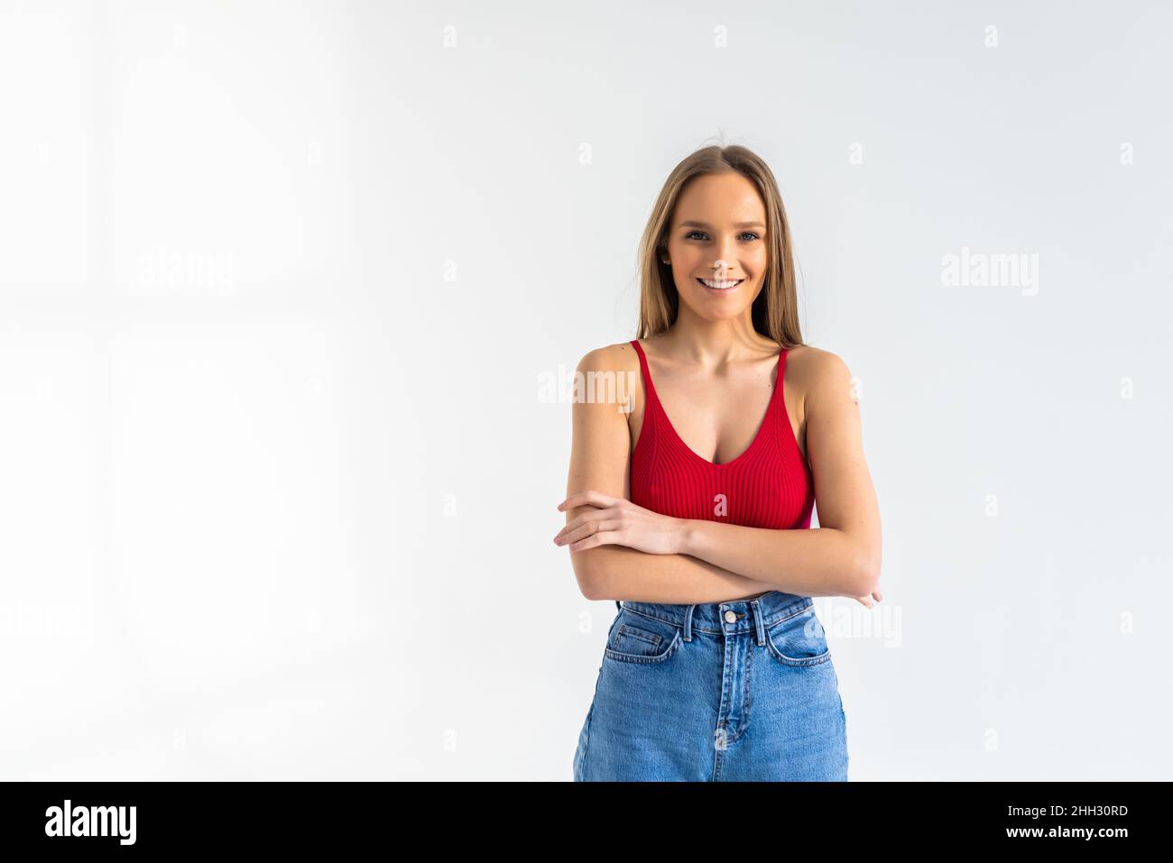 Portrait of a pretty smiling woman posing isolated on a white ...