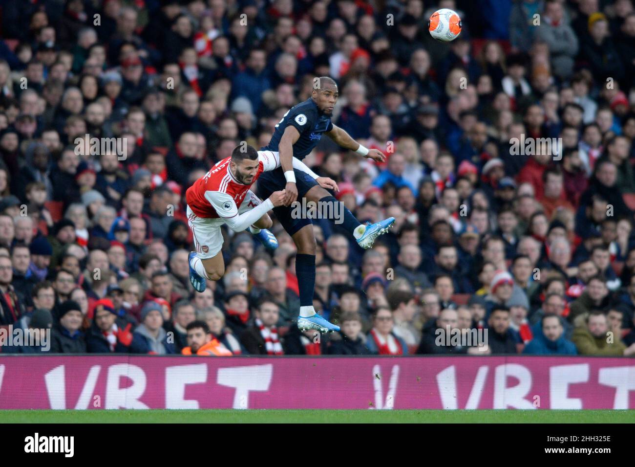 Sead Kolasinac of Arsenal is fouled by Djibril Sidibe of Everton during the Premier League match between Arsenal and Everton at the Emirates Stadium in London, UK - 16th February 2020 Stock Photo