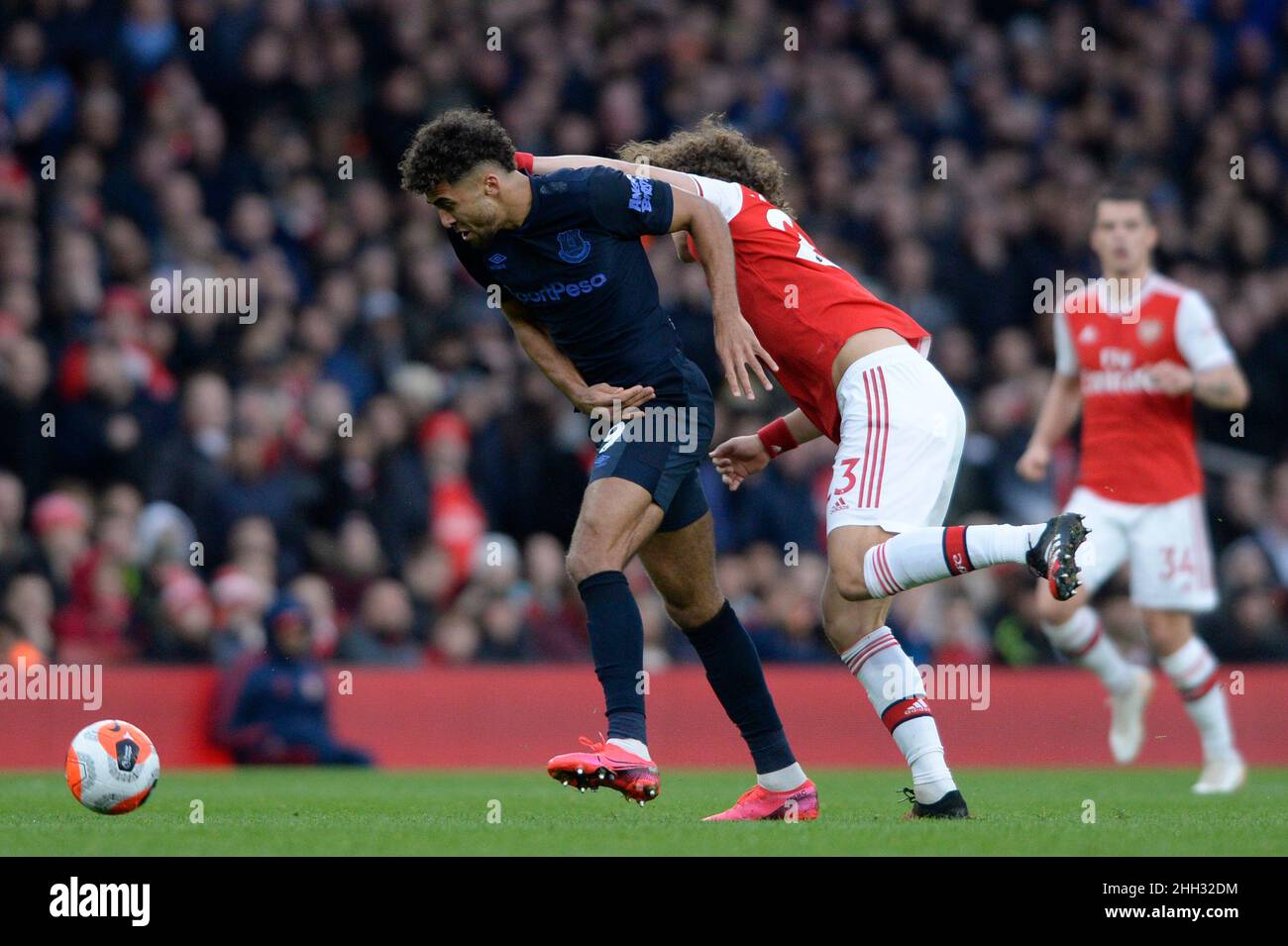 David Luiz of Arsenal and Dominic Calvert-Lewin of Everton in action during the Premier League match between Arsenal and Everton at the Emirates Stadium in London, UK - 16th February 2020 Stock Photo