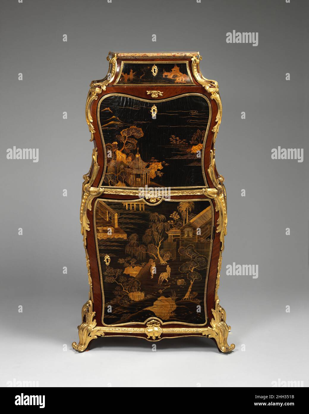 Drop-front secretaire (secrétaire à abattant) ca. 1760 Jean-François Dubut Once the fall front of this secretary, partly decorated with Chinese lacquer, is opened a series of drawers with geometric marquetry is revealed. The overall size indicates that this piece was intended for use in one of the more intimate and private rooms where the owner could write undisturbed. The model of this secretary remained very popular and was repeated a number of times during the nineteenth and twentieth centuries. Most of the mounts of this piece have been replaced. Drop-front secretaire (secrétaire à abattan Stock Photo