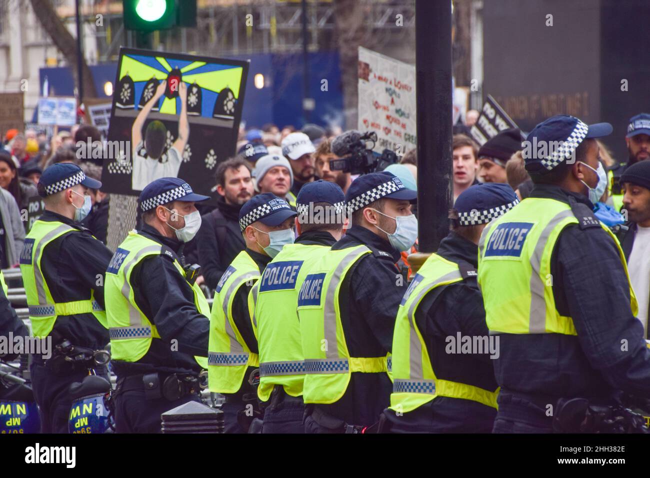 London, UK 22nd January 2022. Police officers guard Downing Street during the protest. Thousands of people marched through Central London in protest against mandatory vaccines for NHS staff, face masks, covid vaccines, vaccination passports and various other grievances fuelled by conspiracy theories. Stock Photo