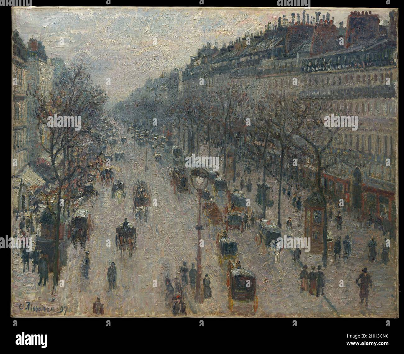 The Boulevard Montmartre on a Winter Morning 1897 Camille Pissarro French After spending six years in rural Éragny, Pissarro returned to Paris, where he painted several series of the grands boulevards. Surveying the view from his lodgings at the Grand Hôtel de Russie in early 1897, Pissarro marveled that he could 'see down the whole length of the boulevards' with 'almost a bird's-eye view of carriages, omnibuses, people, between big trees, big houses that have to be set straight.' From February through April, he recorded—in two scenes of the boulevard des Italiens to the right, and fourteen of Stock Photo
