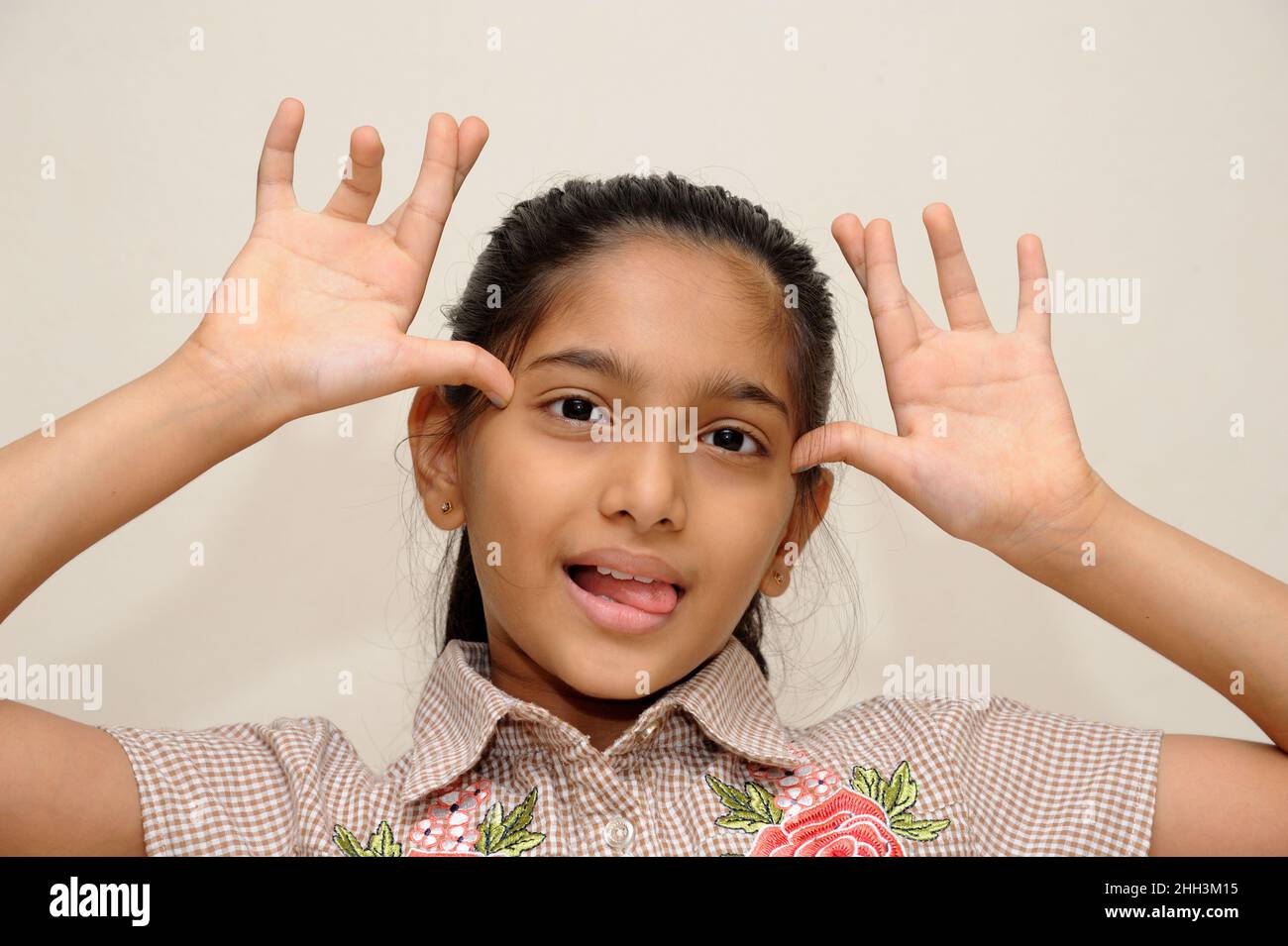 Mumbai Maharashtra India Asia Aug. 13 2021 Beautiful little indian eight years old girl showing funny expression Stock Photo