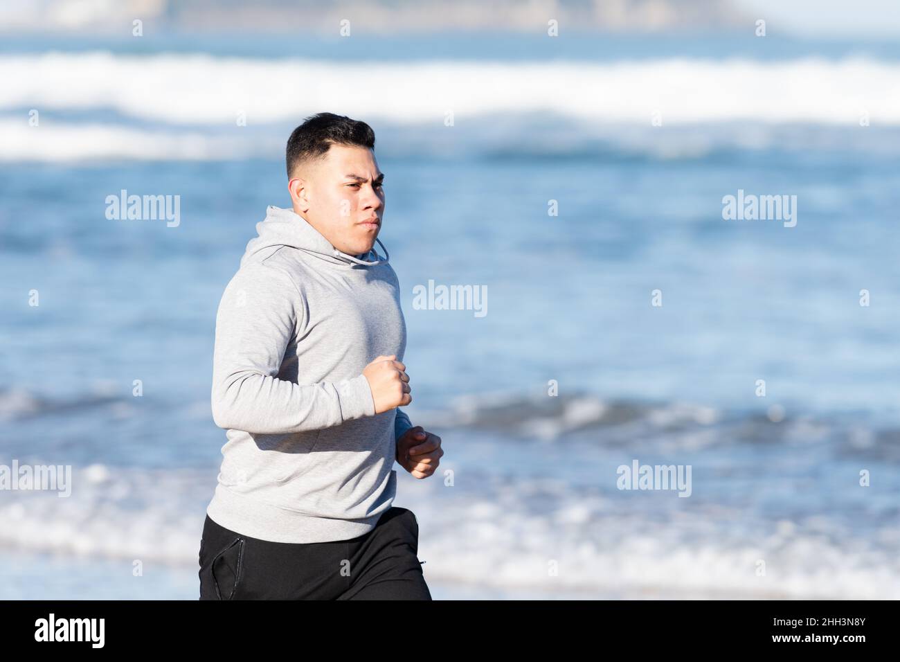 Half body of latin young sportsman focused on his goals Stock Photo
