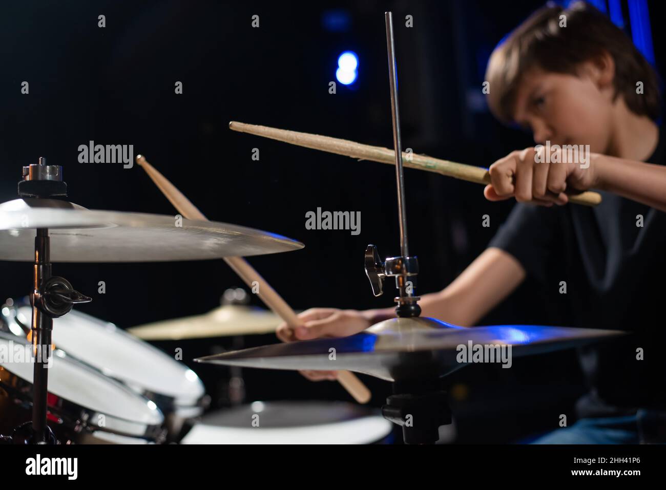 A boy plays drums in a recording studio Stock Photo - Alamy