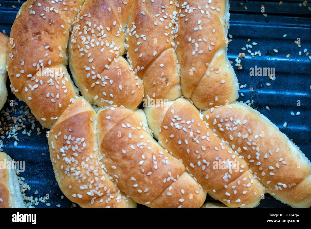 Homemade fresh baked Bread Rolls with Sesame Seeds close up, top view. Stock Photo