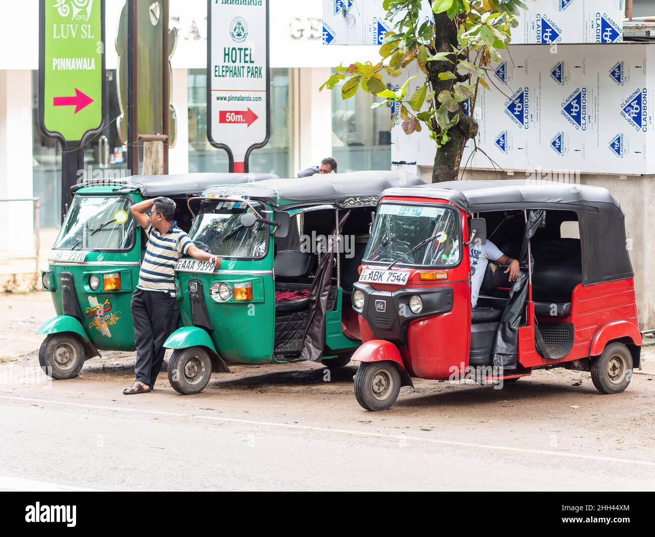 Three auto rickshaws, also called tuk-tuk, parked in Pinnawala, Sri Lanka Stock Photo