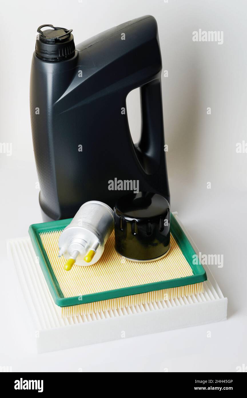 Car motor service theme. Air filters and lubricant oil set isolated on studio background Stock