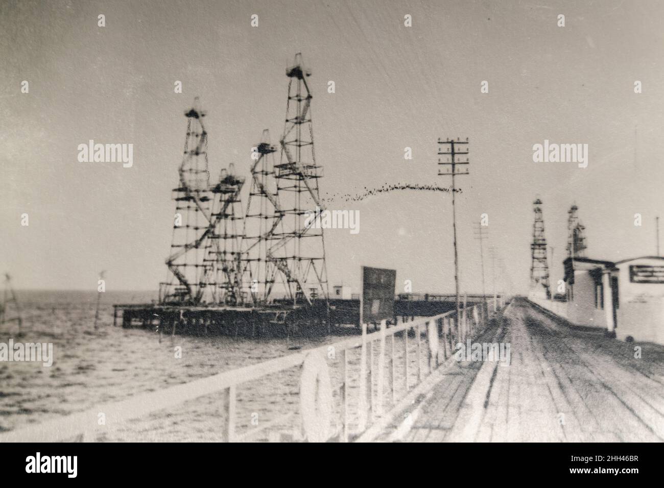 Russia Baku - CIRCA 1920s: Oil fields in Baku on the Caspian Sea. Vintage oil wells Stock Photo